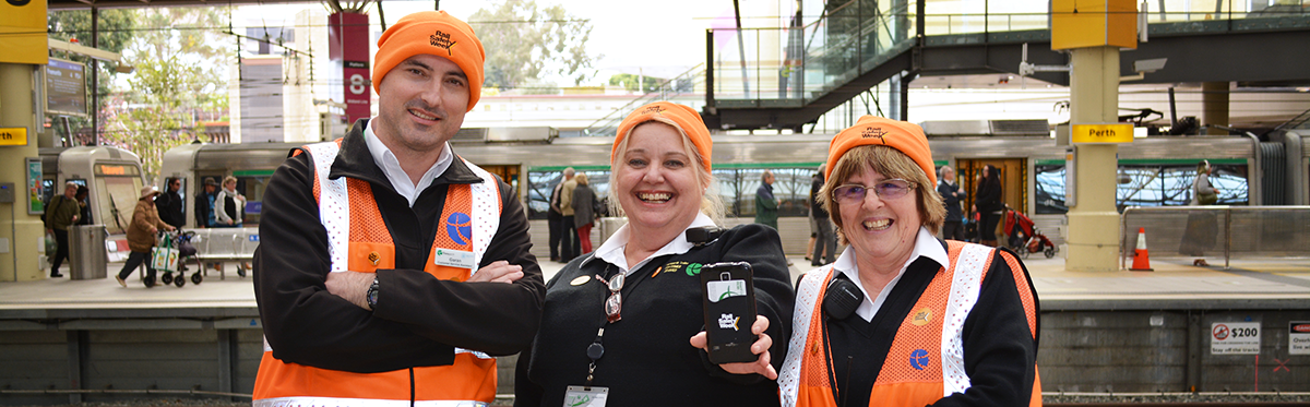 Staff wearing rail safety week gear